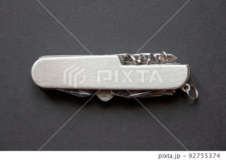 Metallic swiss knife isolated on black Metallic swiss knife isolated on black 92755374