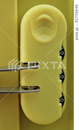coded lock of yellow suitcase. coded lock of yellow suitcase. 92756646