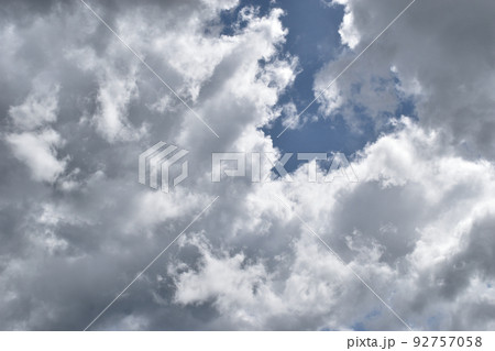 Cumulonimbus cloud formations on tropical blue sky , Nimbus moving , Abstract background from natural phenomenon and gray clouds hunk , Thailand Cumulonimbus cloud formations on tropical blue sky , Nimbus moving , Abstract background from natural phenomenon and gray clouds hunk , Thailand 92757058