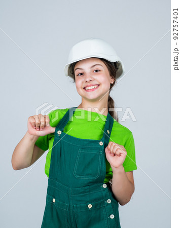 teen girl builder in protective helmet and protective uniform, future career teen girl builder in protective helmet and protective uniform, future career 92757401