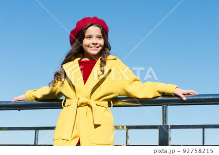 french style fashion. true parisian. kid fashion. stylish girl child after hairdresser. she has unreal curly hair. enjoy autumn day. lucky with weather. cheerful little lady. little girl outdoor 92758215