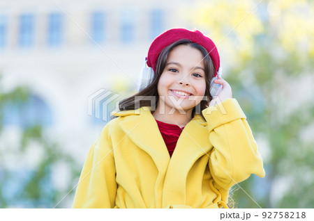 school fall season. small girl listen audio book. small girl in headset. online education. music lover. ebook technology. cheerful parisian girl in french beret. autumn fashion. Your guide to answers 92758218