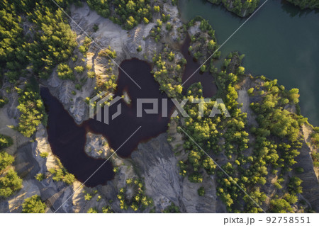 Aerial view of abandoned quarry. Aerial view of abandoned quarry. 92758551
