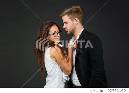 formal couple in love of man and woman on black background, love 92761160