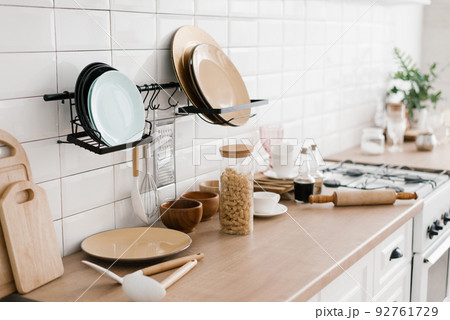 Kitchen utensils are on the cabinet. The interior of the room in the Scandinavian style 92761729