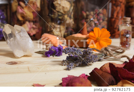 Dried Lavender and Rose Petals on Table With Incense Cones and Crystals 92762175