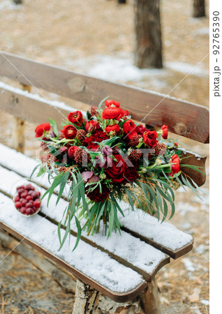 Winter wedding bouquet of red roses 92765390
