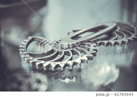 Object printed on metal 3d printer close-up. Object printed in laser sintering machine. Modern 3D printer printing from metal powder. Concept progressive additive DMLS, SLM, SLS Object printed on metal 3d printer close-up. Object printed in laser sintering machine. Modern 3D printer printing from metal powder. Concept progressive additive DMLS, SLM, SLS 92765645