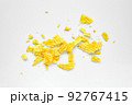 Rippled chips crumbs, scattered potato snack pieces isolated on white background 92767415