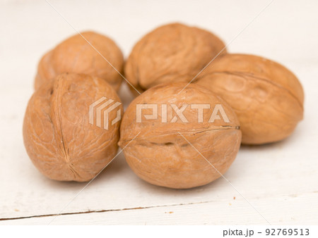 Walnuts on a table 92769513