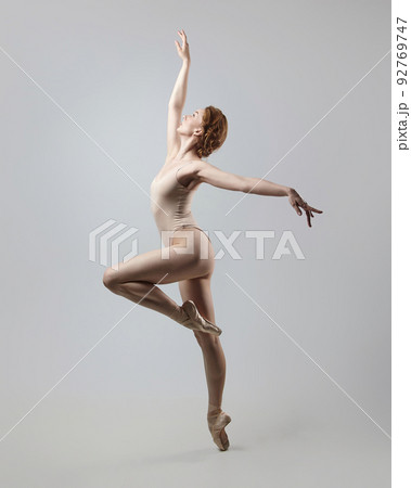charming ballerina posing in the studio on a white background charming ballerina posing in the studio on a white background 92769747