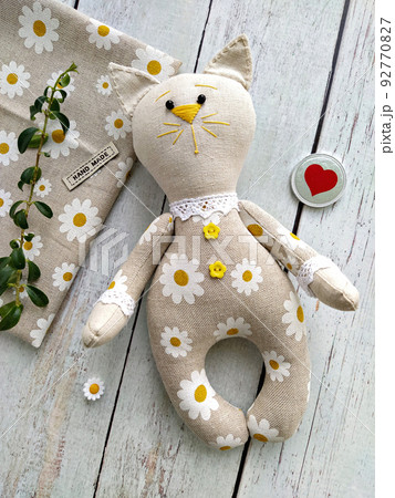Cheerful linen textile toy cat by handmade, top view and sewing accessories, DIY, flat lay 92770827