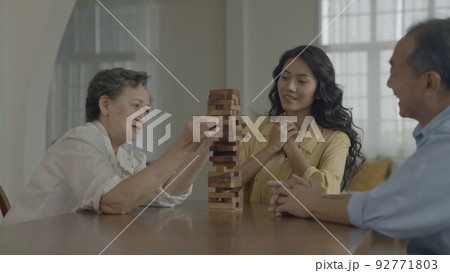 Holiday concept of 4k Resolution. Asian families playing games together in the house. Fun and exciting leisure activities. Holiday concept of 4k Resolution. Asian families playing games together in the house. Fun and exciting leisure activities. 92771803