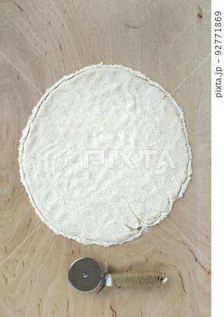 Pizza dough on wooden background 92771869