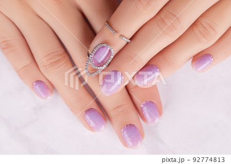 Womans hands with trendy lavender manicure. Spring summer nail design 92774813