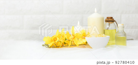 Soft and select focus. Thai Spa. Hot stones setting for massage treatment and relax with yellow orchid Soft and select focus. Thai Spa. Hot stones setting for massage treatment and relax with yellow orchid 92780410