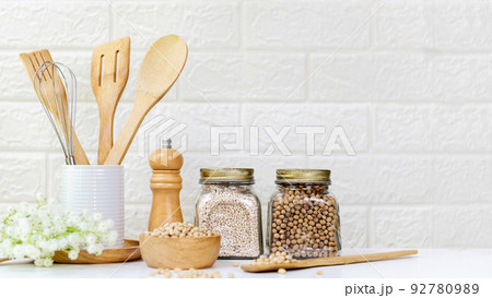 Kitchen tools and kitchenware utensil object with ingredients and mix nut on kitchen shelf wood white Kitchen tools and kitchenware utensil object with ingredients and mix nut on kitchen shelf wood white 92780989