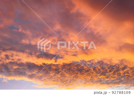 Beautiful sunset with orange clouds. Dramatic sunset sky background. 92788109
