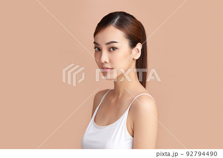 Beautiful young asian woman with clean fresh skin on beige background, Face care, Facial treatment, Cosmetology, beauty and spa, Asian women portrait. 92794490
