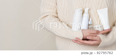 Skincare daily routine for healthy skin. Woman hands holding skincare product set included facial foam, cleanser, serum, moisturizer cream and body lotion packaging. Beauty and cosmetic concept. Skincare daily routine for healthy skin. Woman hands holding skincare product set included facial foam, cleanser, serum, moisturizer cream and body lotion packaging. Beauty and cosmetic concept. 92795762