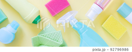 Cleaning concept - cleaning supplies on pastel yellow background 92796986