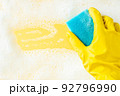 Cleaning concept - foam frame and cleaning sponge on bright background 92796990