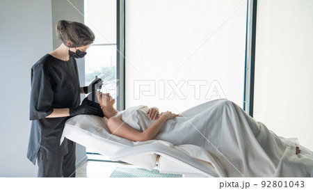 Woman on ultrasonic cleaning procedure. Hardware cosmetology.  92801043