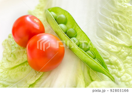 Pod peas and cherry macro Pod peas and cherry macro 92803166