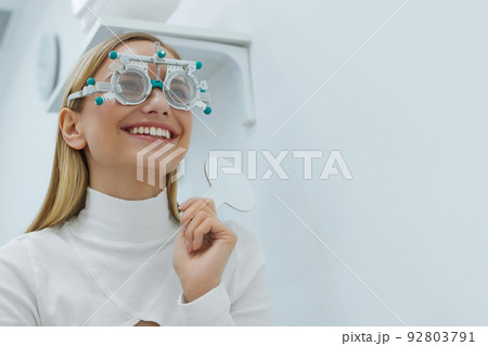 Eye Exam. Woman In Glasses Checking Eyesight At Clinic Eye Exam. Woman In Glasses Checking Eyesight At Clinic 92803791