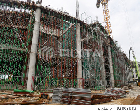 SELANGOR, MALAYSIA -JULY 4, 2021: Scaffolding is installed as temporary support for concrete formwork at the construction site. Installed according to the design approved by the engineer. 92803983
