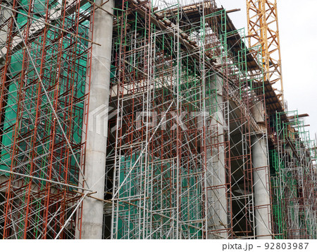 SELANGOR, MALAYSIA -JULY 4, 2021: Scaffolding is installed as temporary support for concrete formwork at the construction site. Installed according to the design approved by the engineer. SELANGOR, MALAYSIA -JULY 4, 2021: Scaffolding is installed as temporary support for concrete formwork at the construction site. Installed according to the design approved by the engineer. 92803987