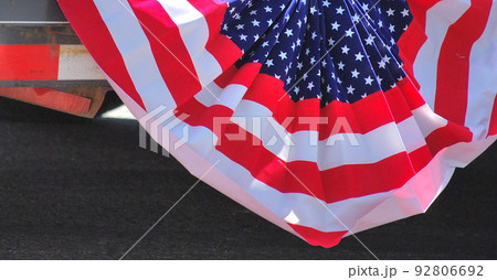 American flag displayed outdoors for the holiday. 92806692