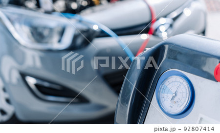 Car air conditioner ac repair service. Refill automobile ac compressor and checking auto conditioning system. Mechanic engine auto car service. 92807414
