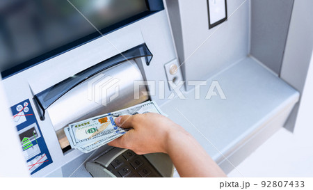 Atm machine money cash. Woman withdraw money bill. Holding american hundred dollar cash. Bank credit card and dollar bill. Atm machine money cash. Woman withdraw money bill. Holding american hundred dollar cash. Bank credit card and dollar bill. 92807433