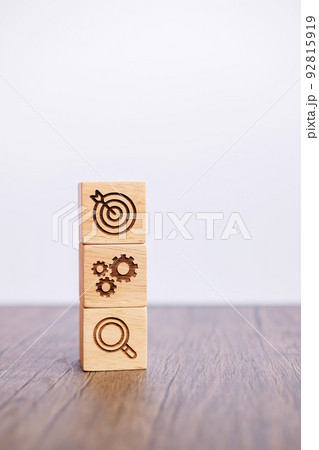 wood block with business goal, strategy, target, mission, action, objective, teamwork, brainstorm and idea concept 92815919