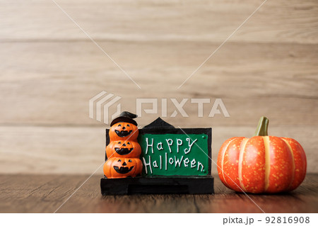 Orange pumpkin on table with copy space for banner background. Happy Halloween day, Hello October, fall autumn season, Festive, party and holiday concept Orange pumpkin on table with copy space for banner background. Happy Halloween day, Hello October, fall autumn season, Festive, party and holiday concept 92816908
