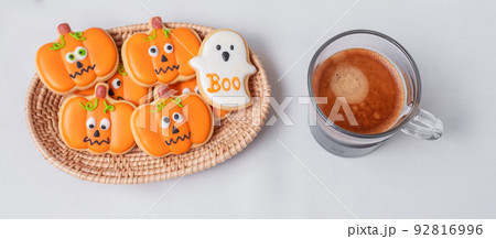 hot espresso coffee  or chocolate cup with funny Halloween Cookies. Happy Halloween day, Trick or Threat, Hello October, fall autumn, Traditional, party and holiday concept 92816996