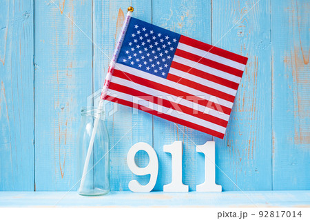 911 text and United States of America flag on wooden table background. Patriot Day, September, memorial and Never Forget concept 911 text and United States of America flag on wooden table background. Patriot Day, September, memorial and Never Forget concept 92817014