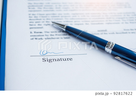 signature with pen on contract documents. Contract agreement, approve, law and deal concepts 92817622