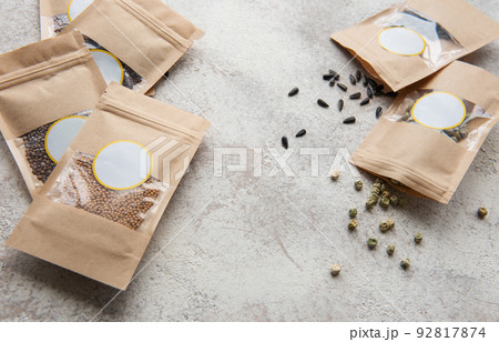 Microgreen seeds in paper bags and equipment for sowing microgreens. 92817874