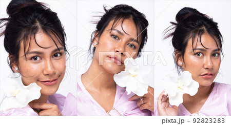 Asian Indian woman show beautiful smile happy lips, hold white flower as fresh clean skin care Asian Indian woman show beautiful smile happy lips, hold white flower as fresh clean skin care 92823283