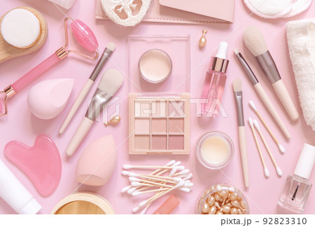 Natural skin care products and decorative cosmetics on light pink, top view Natural skin care products and decorative cosmetics on light pink, top view 92823310