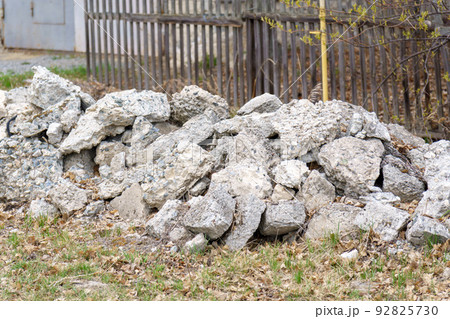 Stones on the ground for construction work, raw materials for construction of building. Selective focus Stones on the ground for construction work, raw materials for construction of building. Selective focus 92825730