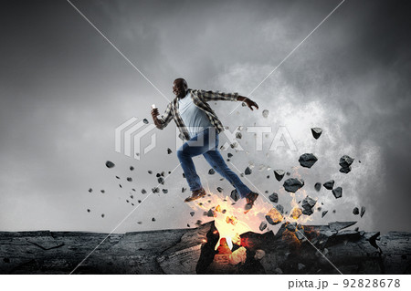 Determined businessman on his way to success leaving fire trails Determined businessman on his way to success leaving fire trails 92828678