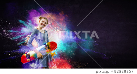 Beautiful young girl with skate board Beautiful young girl with skate board 92829257
