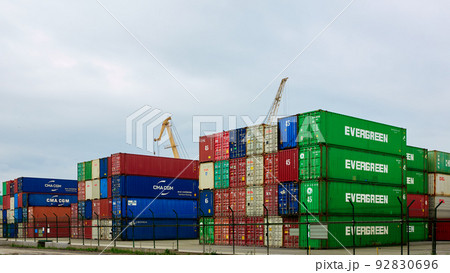 Odessa, Ukraine - May 19, 2021: Freight containers in the port terminal. Containers labeled Evergreen in the foreground. 92830696