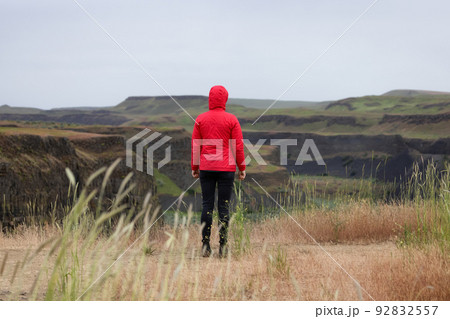 Woman Hiker at American Nature Landscape during cloudy day Woman Hiker at American Nature Landscape during cloudy day 92832557