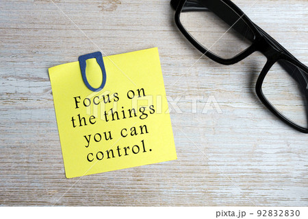 Motivational quote on sticky yellow note - Focus on the things you can control. Motivational quote on sticky yellow note - Focus on the things you can control. 92832830