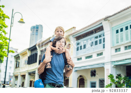 Dad and son in the background of Old houses in the Old Town of Georgetown, Penang, Malaysia Dad and son in the background of Old houses in the Old Town of Georgetown, Penang, Malaysia 92833337