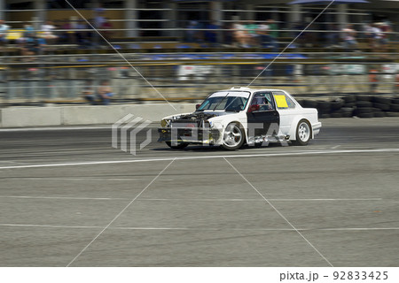 Unknown rider on the car overcomes the track 92833425